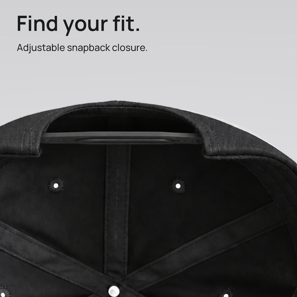 Close detail of the black Dad Club cap’s adjustable snapback closure. Find your fit.