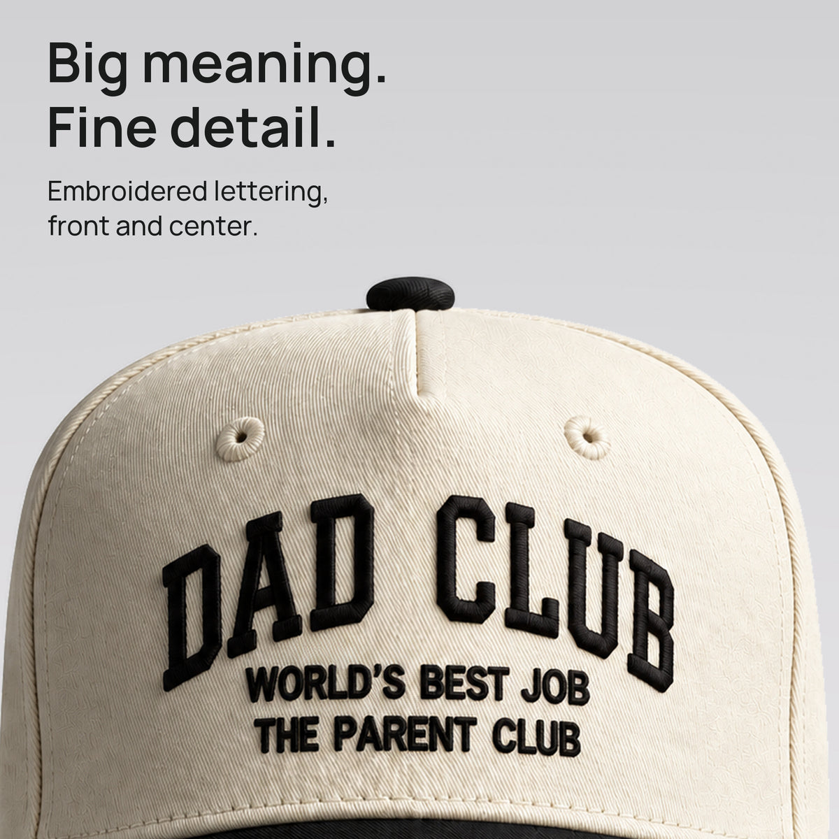 Close detail of black Dad Club embroidery on cream cotton twill. Big meaning. Fine detail.