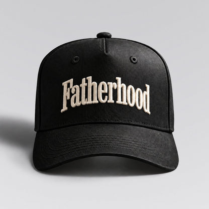 Fatherhood hat in Black by The Parent Club. Front studio view with wider framing.