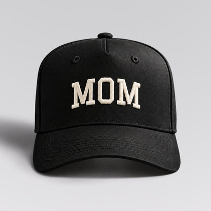 MOM cap in black with ivory embroidery by The Parent Club. Front studio view with wider framing.