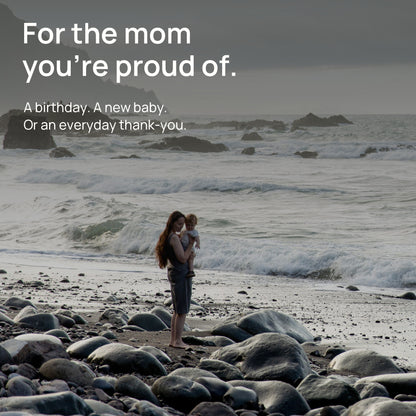 A mother holds her child beside the sea. For the mom you’re proud of. A birthday, a new baby, or an everyday thank-you.