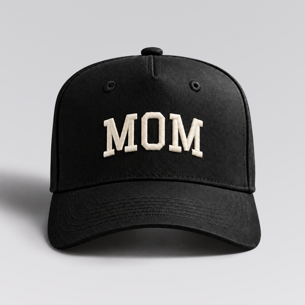 MOM cap in black with ivory embroidery by The Parent Club. Front studio view with wider framing.